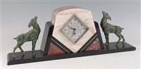 Lot 191 - A French Art Deco polished black slate and...