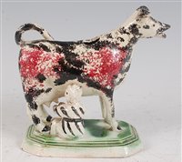 Lot 1095 - A circa 1800 Prattware cow creamer with...