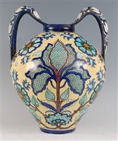 Lot 1096 - A late 19th century Italian faience twin...