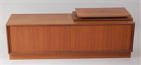 Lot 414 - A 1960s G-Plan teak low side cupboard, having...