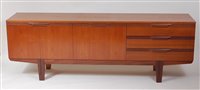 Lot 444 - A 1960s teak long sideboard, probably English,...
