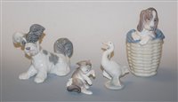 Lot 11 - A Lladro porcelain figure modelled as a dog...