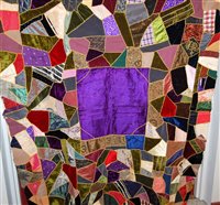 Lot 61 - An early 20th century patchwork table cloth...