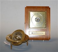 Lot 100 - A modern brass table top compass the outer...