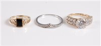 Lot 309 - An unmarked diamond half hoop wishbone ring...