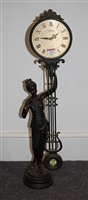 Lot 103 - A modern Juliana quartz pendulum figural table...