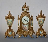 Lot 129 - A German gilt metal cased and porcelain inset...