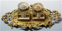 Lot 224 - A circa 1900 brass desk stand, 25cm