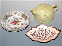 Lot 227 - A Japanese stoneware teapot and cover, relief...