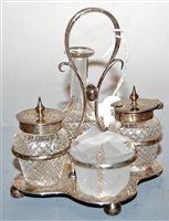 Lot 412 - An Edwardian silver four bottle cruet stand, h....