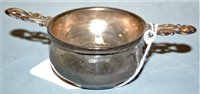 Lot 417 - A modern silver twin handled strainer on stand