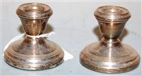 Lot 418 - A pair of modern silver dwarf candlesticks on...