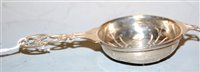 Lot 424 - A George V silver strainer, having typical...