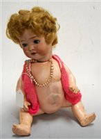 Lot 555 - An early 20th century German bisque head doll,...