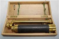 Lot 562 - An early 20th century brass and leather clad...