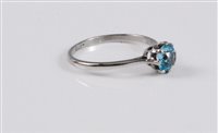 Lot 2592 - A blue zircon ring, the round pale blue zircon,...