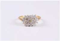 Lot 2646 - An 18ct diamond cluster ring, the diamond...
