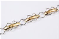 Lot 1265 - A 14ct bi-colour gold fancy link bracelet,...