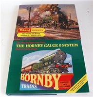 Lot 905 - Six various hard back train related volumes to...
