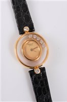 Lot 1248 - A lady's Chopard Happy Diamonds quartz...