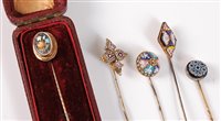 Lot 2515 - Five stick pins: a pietra dura stick pin, the...