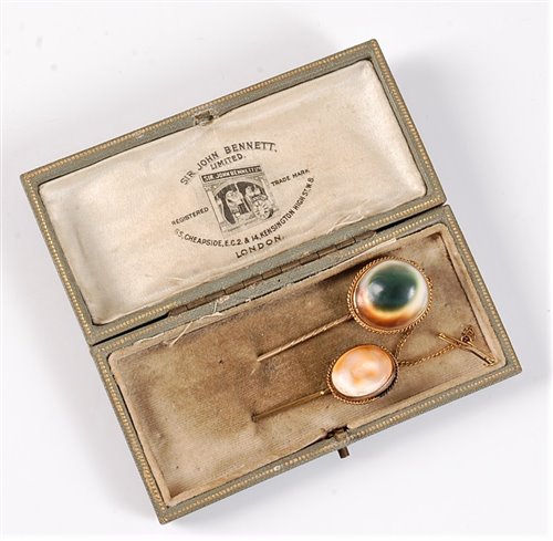 Lot 2517 - Two operculum stick pins: the oval operculum...