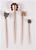 Lot 2519 - Four gemset stick pins: a diamond fox head...