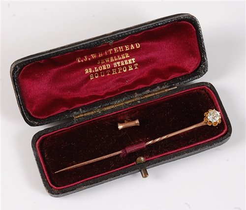 Lot 2520 - A diamond solitaire convertible stick pin: the...