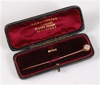 Lot 2520 - A diamond solitaire convertible stick pin: the...
