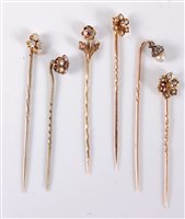 Lot 2523 - Six stick pins: to include a 9ct seed pearl...
