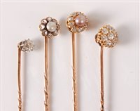 Lot 2524 - Four diamond and seed pearl stick pins: to...