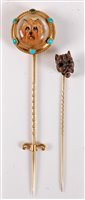 Lot 2528 - Two stick dog stick pins: a reverse painted...