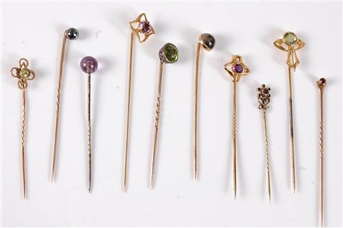Lot 2536 - Ten gemset stick pins: a moss agate stick pin...