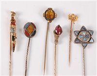 Lot 2543 - Six gemset stick pins: a multi gemset dirk...
