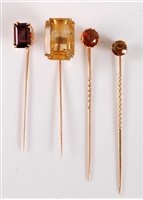 Lot 2551 - Four gemset stick pins: to include an...