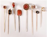Lot 2552 - Eight gemset stick pins: a rock crystal with...