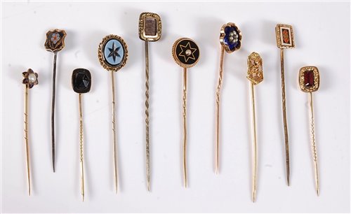 Lot 2557 - Ten various stick pins: to include garnet,...