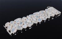 Lot 1266 - A contemporary moonstone cuff/bracelet, the...