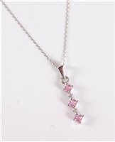 Lot 2612 - A 9ct white gold pink topaz and diamond...