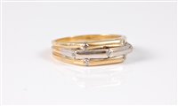 Lot 1308 - An 18k bi-colour gold and diamond ring, the...