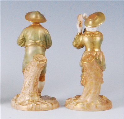 Lot 1094 - A pair of Royal Worcester shot enamel figures,...