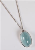 Lot 1256 - A cats eye aquamarine pendant, the oval...