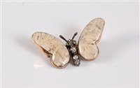 Lot 1251 - A 15ct gemset and diamond white butterfly...