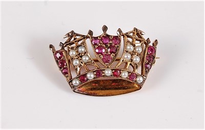 Lot 1221 - A 9ct ruby and seed pearl naval crown brooch,...
