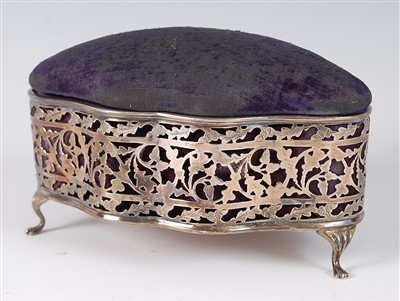 Lot 1185 - An Edwardian silver ring box, of pierced and...