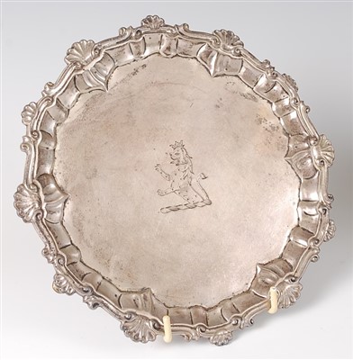 Lot 1186 - An early George III silver card waiter, having...