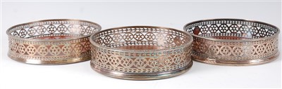 Lot 1193 - A near-set of three 19th century cruet stands,...