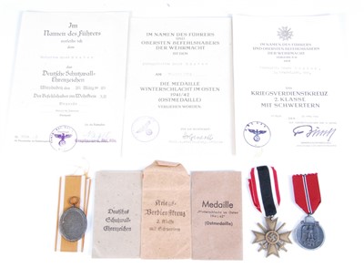 Lot 27 - A WW II German group of three medals