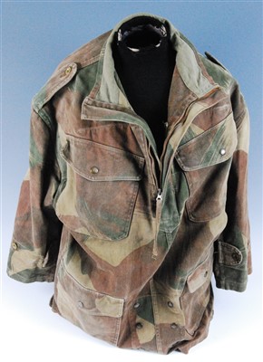 Lot 144 - A post WW II Dennison half zip smock