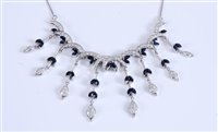 Lot 1243 - A sapphire and diamond necklace, the...